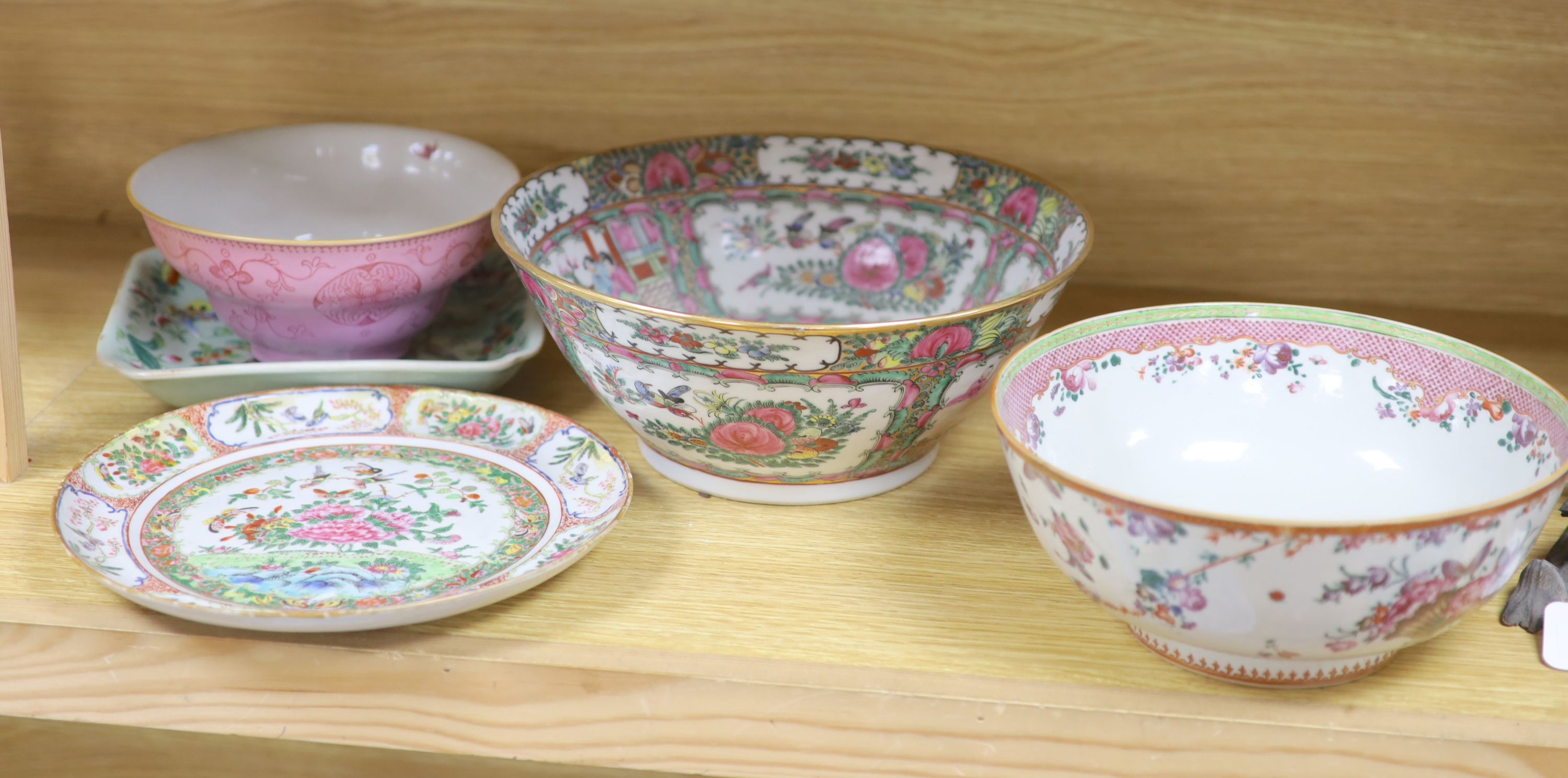 A Chinese pink ground bowl, late 19th century together with two other bowls, a famille verte dish and a plate